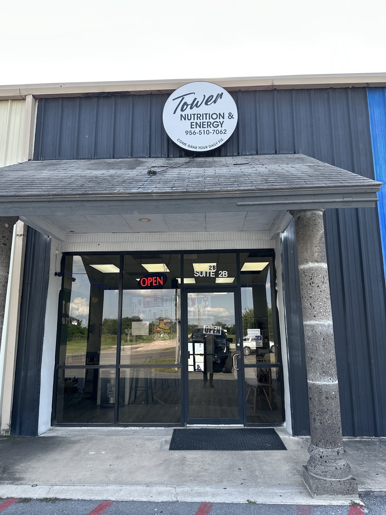 The authentic Tower Nutrition storefront and entrance in Alamo, Texas